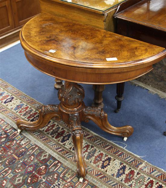 A Victorian walnut card table, W.92cm